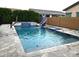 Inviting pool featuring a slide, integrated spa, and easy access steps for Gathering fun and relaxation at 9187 W Parkside Ln, Peoria, AZ 85383