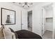 Comfortable bedroom featuring modern light fixture, and an open doorway at 9815 S 11Th St, Phoenix, AZ 85042