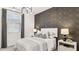 Stylish bedroom featuring a striking accent wall and complementary modern decor at 9815 S 11Th St, Phoenix, AZ 85042