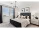 Cozy bedroom with a plush bed, ample natural light from large windows, and tasteful decor at 9815 S 11Th St, Phoenix, AZ 85042