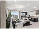 Open-concept living room flowing into the kitchen, featuring modern decor and ample natural light at 9815 S 11Th St, Phoenix, AZ 85042