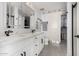 Bright bathroom with a double sink vanity, modern fixtures, and sliding barn door to the walk-in closet at 1 E Lexington Ave # 1108, Phoenix, AZ 85012