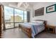 Bright, modern bedroom features stunning city views through large windows, and simple decor at 1 E Lexington Ave # 1108, Phoenix, AZ 85012