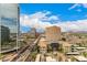 Expansive city view featuring prominent buildings, busy streets, and clear blue skies with scattered clouds at 1 E Lexington Ave # 1108, Phoenix, AZ 85012