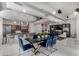 Refined dining area includes modern table, plush chairs, and stylish, open kitchen area at 1 E Lexington Ave # 1108, Phoenix, AZ 85012