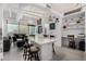 Open-concept kitchen and dining area featuring modern countertops and sleek bar stool seating at 1 E Lexington Ave # 1108, Phoenix, AZ 85012