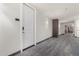 Bright condo hallway with a unit door, painted in neutral tones with modern flooring at 1 E Lexington Ave # 1108, Phoenix, AZ 85012