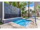Modern hot tub with blue tile accents and waterfall feature near the pool area at 1 E Lexington Ave # 1108, Phoenix, AZ 85012