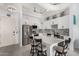 Beautiful modern kitchen with stainless steel appliances, countertop seating, and white cabinetry at 1 E Lexington Ave # 1108, Phoenix, AZ 85012