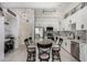 Modern open-concept kitchen with sleek appliances, countertop seating, and bright white cabinetry at 1 E Lexington Ave # 1108, Phoenix, AZ 85012