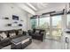 Stylish living room boasts a spacious seating area, modern shelving, and stunning city views at 1 E Lexington Ave # 1108, Phoenix, AZ 85012
