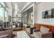 Relaxing lounge boasts stylish seating, sleek shelving, and views from a large window at 1 E Lexington Ave # 1108, Phoenix, AZ 85012