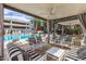 Stylish outdoor lounge area with comfortable seating, ceiling fan, and views of the pool at 1 E Lexington Ave # 1108, Phoenix, AZ 85012