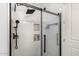 Luxurious shower featuring white subway tiles, a rainfall showerhead, and built-in shelving for toiletries at 1 E Lexington Ave # 1108, Phoenix, AZ 85012