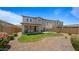 Spacious backyard featuring a well-maintained lawn, covered patio, and desert landscaping at 10224 E Talameer Ave, Mesa, AZ 85212