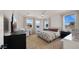 Bright bedroom with large windows and plush bedding, perfect for relaxation and rest at 10224 E Talameer Ave, Mesa, AZ 85212