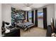 Stylish bedroom with bold wallpaper, creating a unique and inviting space at 10224 E Talameer Ave, Mesa, AZ 85212