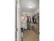 Walk-in closet with ample shelving and organization for storage and convenience at 10224 E Talameer Ave, Mesa, AZ 85212