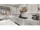 Bright kitchen with white cabinets, quartz countertops, stainless steel appliances, and subway tile backsplash at 10224 E Talameer Ave, Mesa, AZ 85212