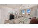 Bright main bedroom with large windows, a ceiling fan and calming color palette at 10224 E Talameer Ave, Mesa, AZ 85212