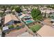 Aerial view of a backyard featuring a rectangular pool, patio area, desert landscaping, and privacy fence at 1057 W Laurel Ave, Gilbert, AZ 85233