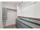 Functional closet with built-in shelving and drawers to maximize storage space in a modern design at 1057 W Laurel Ave, Gilbert, AZ 85233