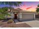 Charming single-story home featuring desert landscaping, a tile roof, and a spacious two-car garage at 1057 W Laurel Ave, Gilbert, AZ 85233