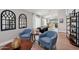 Open-concept living space with stylish decor, leading to a dining area and offering ample natural light at 1057 W Laurel Ave, Gilbert, AZ 85233