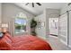 Spacious main bedroom with private bath and views of the outdoor pool and landscaping at 1057 W Laurel Ave, Gilbert, AZ 85233