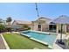 Beautiful backyard pool and spa, surrounded by manicured landscaping and a patio area at 1057 W Laurel Ave, Gilbert, AZ 85233