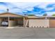 Exterior view of home with a carport and well-maintained landscaping at 11149 W Palm Ridge Dr, Sun City, AZ 85351