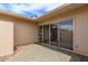 Charming backyard featuring sliding glass doors and a rock landscape at 11149 W Palm Ridge Dr, Sun City, AZ 85351