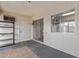 Bright sun room with white walls, sliding glass door, and neutral carpet at 11149 W Palm Ridge Dr, Sun City, AZ 85351
