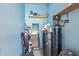 Functional utility room featuring shelving, and storage for cleaning supplies at 11149 W Palm Ridge Dr, Sun City, AZ 85351