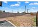 Spacious backyard featuring a block wall, wooden fence, and desert landscaping under a sunny sky at 1306 E Fillmore St, Phoenix, AZ 85006