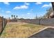 Spacious backyard featuring a concrete patio, block fencing, and small green space perfect for outdoor activities at 1306 E Fillmore St, Phoenix, AZ 85006