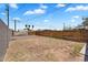 Expansive backyard with a wooden fence and block wall offering privacy and space for outdoor activities at 1306 E Fillmore St, Phoenix, AZ 85006