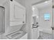 Stacked washer and dryer with a partial view into the adjacent bathroom at 1306 E Fillmore St, Phoenix, AZ 85006