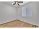 Bright bedroom with ceiling fan and a window allowing for natural light at 1306 E Fillmore St, Phoenix, AZ 85006