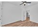 Simple bedroom featuring wood-look floors, ceiling fan, and neutral paint at 1306 E Fillmore St, Phoenix, AZ 85006