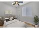 Cozy bedroom with ceiling fan, carpet, and a window allowing for natural light at 1306 E Fillmore St, Phoenix, AZ 85006