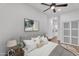 Staged bedroom with gray decor, ceiling fan, and sliding closet doors at 1306 E Fillmore St, Phoenix, AZ 85006