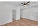 Bright bedroom with ceiling fan, showing doorway to the next room and a window at 1306 E Fillmore St, Phoenix, AZ 85006