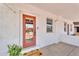 Inviting entryway with covered porch, a glass-paneled front door, and a 'Welcome' mat at 1306 E Fillmore St, Phoenix, AZ 85006