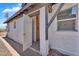 Exterior side view of property showcasing an open door, siding, and window at 1306 E Fillmore St, Phoenix, AZ 85006