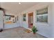 Welcoming front porch with a 'Welcome' mat, red door, and a small potted plant at 1306 E Fillmore St, Phoenix, AZ 85006