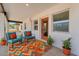 Charming front porch with colorful outdoor seating and a welcoming entrance at 1306 E Fillmore St, Phoenix, AZ 85006