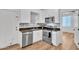 Bright kitchen featuring stainless steel appliances, white cabinetry, and granite countertops at 1306 E Fillmore St, Phoenix, AZ 85006