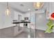 Modern kitchen featuring stainless steel appliances, white cabinets, and pendant lighting at 1306 E Fillmore St, Phoenix, AZ 85006