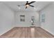 Bright room with wood flooring and natural light from large windows at 1306 E Fillmore St, Phoenix, AZ 85006